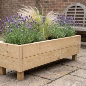 Winsford 120cm timber trough planter on legs planted with lavender and ornamental grasses